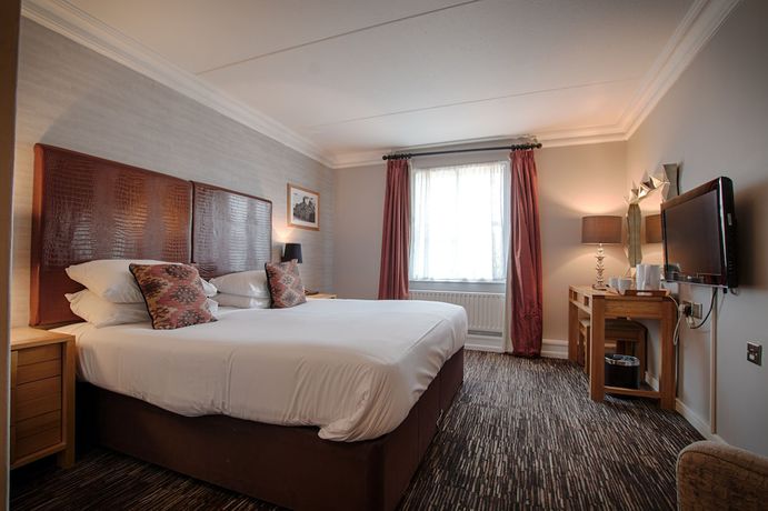 Imagen de la habitación del Hotel Saracens Head. Foto 13