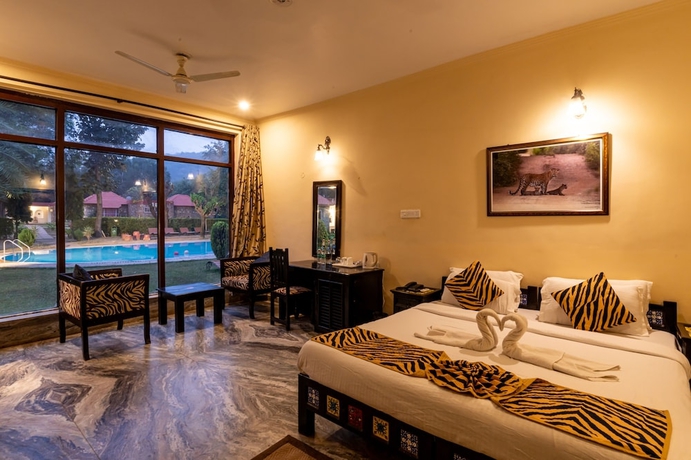 Imagen de la habitación del Hotel Sariska Tiger Heaven Resort. Foto 9