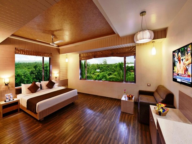 Imagen de la habitación del Hotel Sarovar Portico Sasangir. Foto 19
