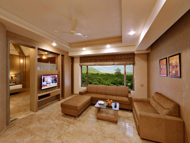 Imagen de la habitación del Hotel Sarovar Portico Sasangir. Foto 20