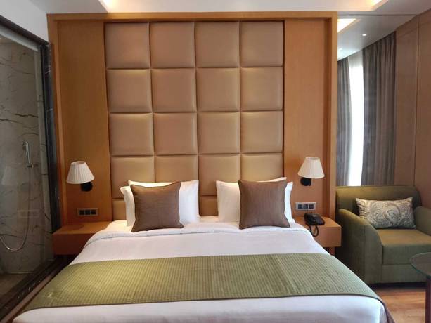 Imagen de la habitación del Hotel Sarovar Portico Sonipat. Foto 4