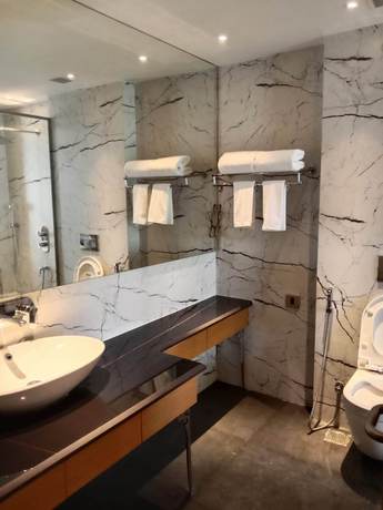 Imagen de la habitación del Hotel Sarovar Portico Sonipat. Foto 6