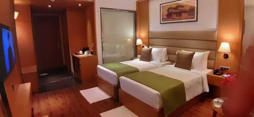 Imagen de la habitación del Hotel Sarovar Portico Sonipat. Foto 10