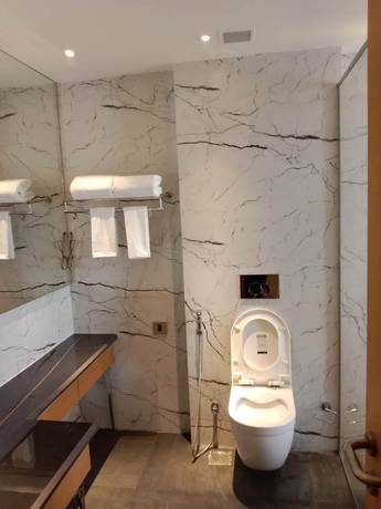 Imagen de la habitación del Hotel Sarovar Portico Sonipat. Foto 11