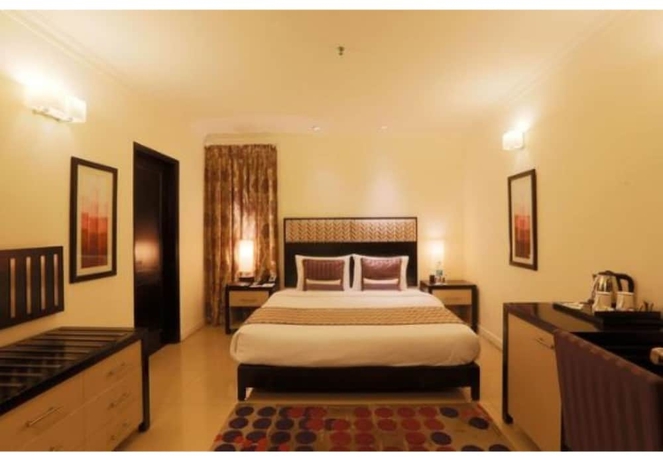 Imagen de la habitación del Hotel Sarovar Portico Surajkund Faridabad. Foto 9
