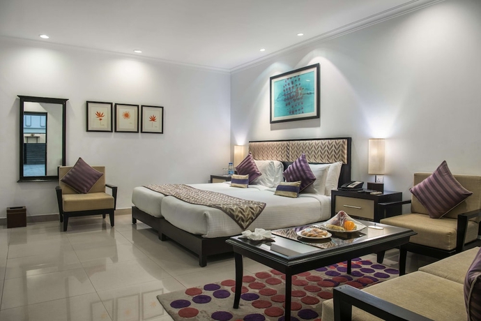 Imagen de la habitación del Hotel Sarovar Portico Surajkund Faridabad. Foto 14