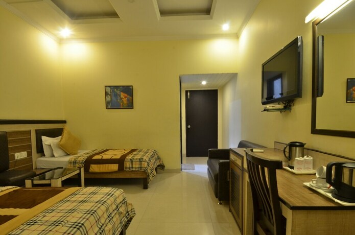 Imagen de la habitación del Hotel Sarovar Regency. Foto 25