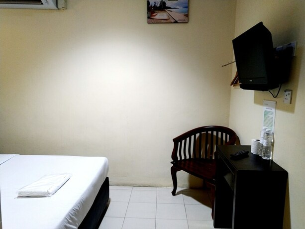Imagen de la habitación del Hotel Sastria Hotel. Foto 13