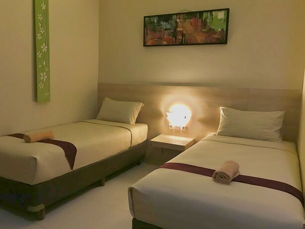 Imagen de la habitación del Hotel Savita Garden Inn. Foto 19