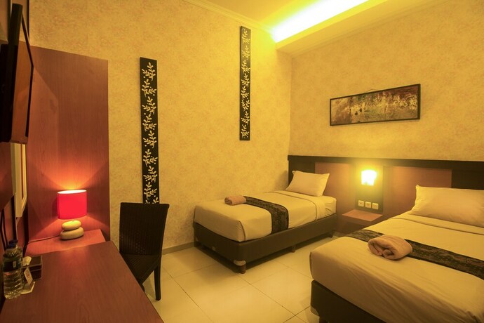 Imagen de la habitación del Hotel Savita Garden Inn. Foto 26