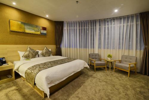 Imagen de la habitación del Hotel Sb Junying. Foto 7