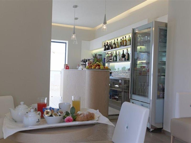 Imagen del bar/restaurante del Hotel Scala Dei Turchi Resort. Foto 8