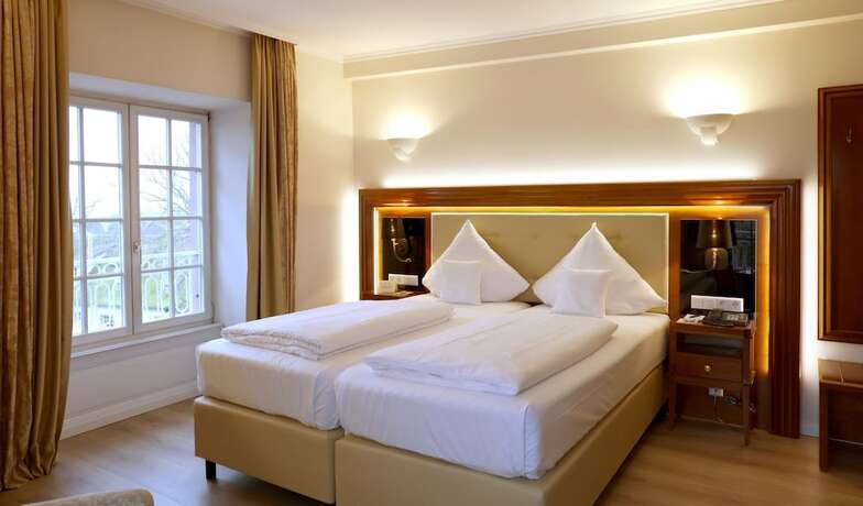 Imagen de la habitación del Hotel Schloss Edesheim. Foto 17