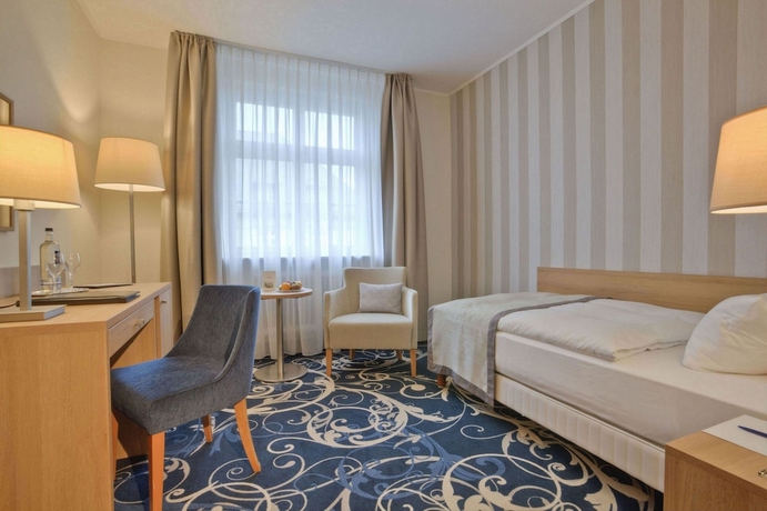 Imagen de la habitación del Hotel Schlosshotel Karlsruhe. Foto 17