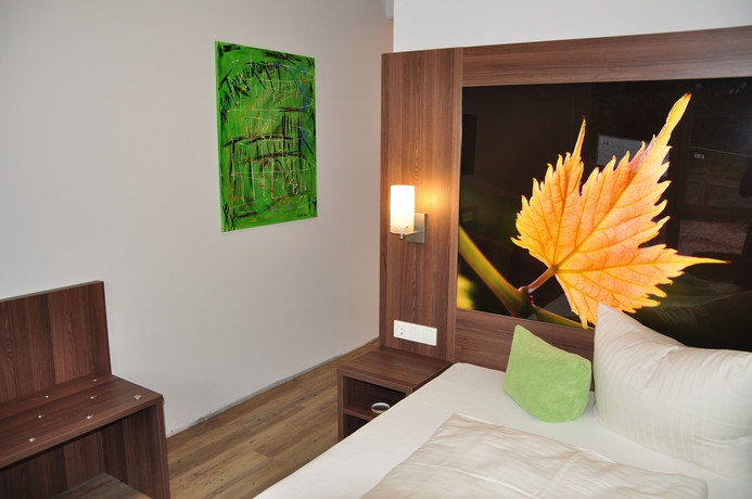 Imagen de la habitación del Hotel Schroeders Wein-style-hotel. Foto 7