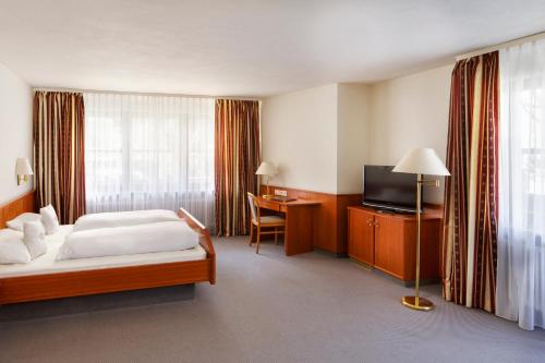 Imagen de la habitación del Hotel Schw&auml;rs L&ouml;wen Freiburg. Foto 7