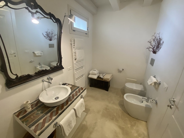 Imagen de la habitación del Hotel Scilla Maris Charming Suites-Restaurant. Foto 9