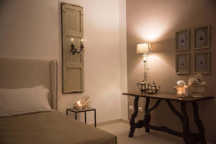 Imagen de la habitación del Hotel Scilla Maris Charming Suites-Restaurant. Foto 11