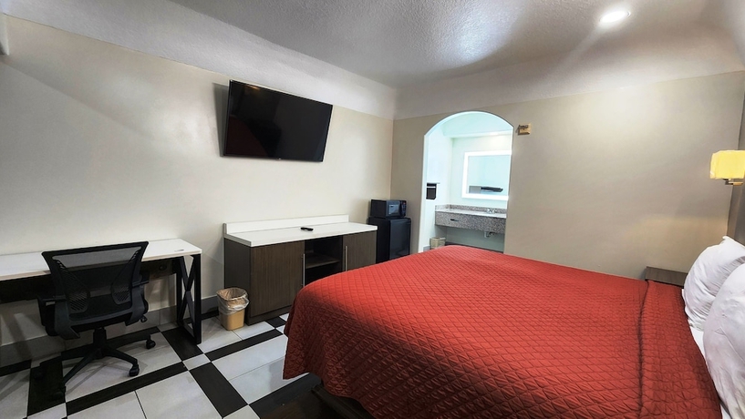 Imagen de la habitación del Hotel Scottish Inns and Suites Sam Houston Pkwy. Foto 9