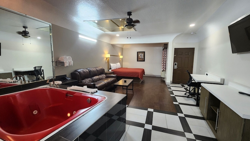 Imagen de la habitación del Hotel Scottish Inns and Suites Sam Houston Pkwy. Foto 11