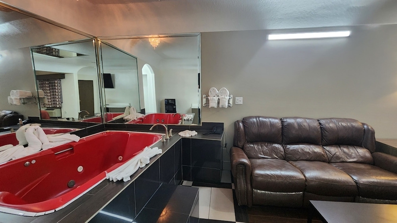 Imagen de la habitación del Hotel Scottish Inns and Suites Sam Houston Pkwy. Foto 13