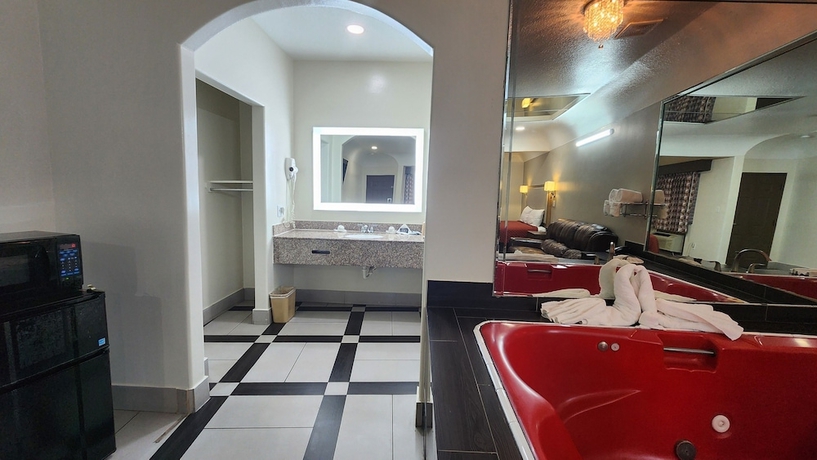 Imagen de la habitación del Hotel Scottish Inns and Suites Sam Houston Pkwy. Foto 14
