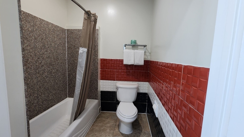 Imagen de la habitación del Hotel Scottish Inns and Suites Sam Houston Pkwy. Foto 17