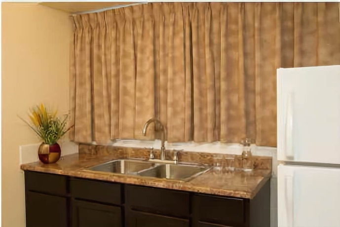 Imagen de la habitación del Hotel Scott's Inn and Suites. Foto 14