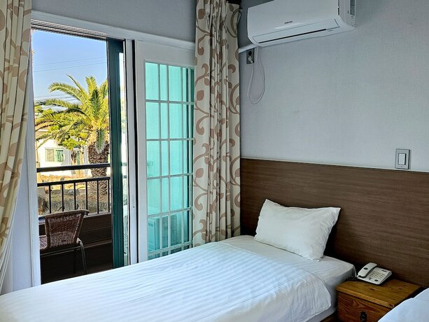 Imagen de la habitación del Hotel Sea Cliff Jeju. Foto 18
