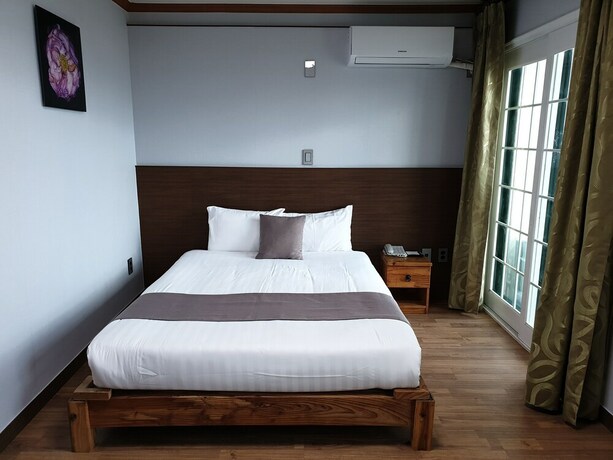 Imagen de la habitación del Hotel Sea Cliff Jeju. Foto 20