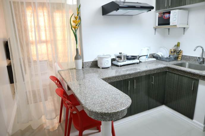 Imagen de la habitación del Hotel Sea Pearl Manila Suites. Foto 11