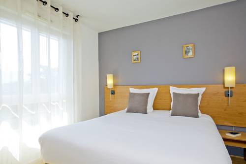 Imagen de la habitación del Hotel Séjours & Affaires Annecy Le Pont Neuf. Foto 3