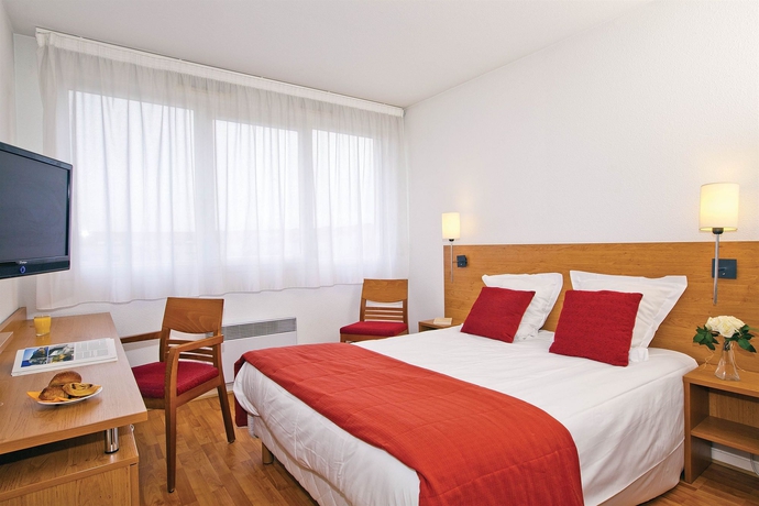 Imagen de la habitación del Hotel Séjours and Affaires Lyon Saint-nicolas. Foto 4