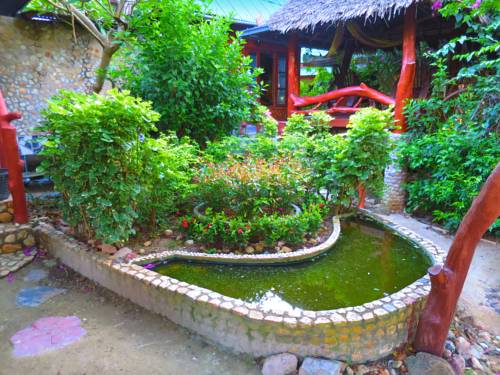 Imagen de la habitación del Hotel Seaflower Bungalows. Foto 15