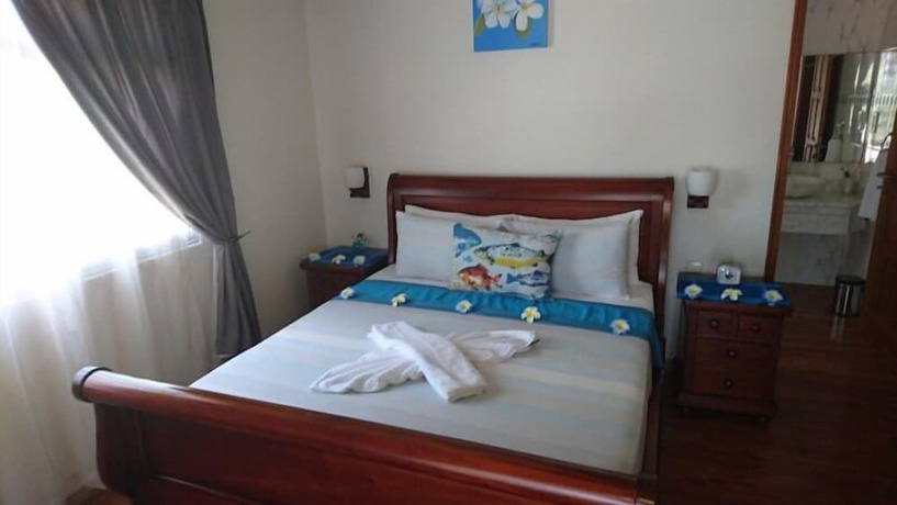 Imagen de la habitación del Hotel Seashell Beach Villa. Foto 17