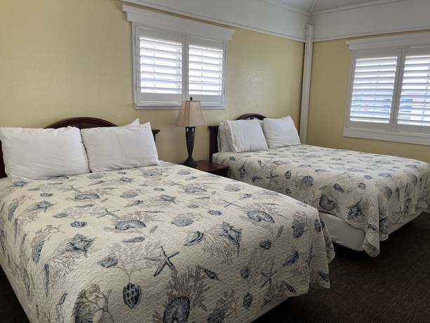 Imagen de la habitación del Hotel Seashell Village Resort near the beach with kitchens. Foto 10