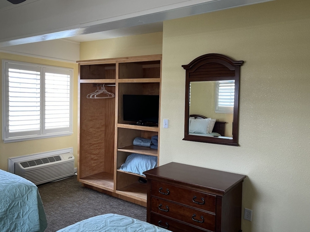 Imagen de la habitación del Hotel Seashell Village Resort near the beach with kitchens. Foto 13