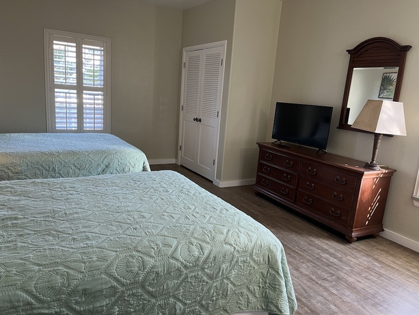 Imagen de la habitación del Hotel Seashell Village Resort near the beach with kitchens. Foto 15