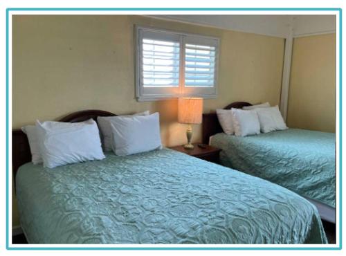 Imagen de la habitación del Hotel Seashell Village Resort near the beach with kitchens. Foto 20