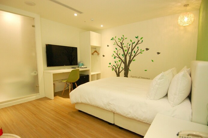 Imagen de la habitación del Hotel Season 5 Inn. Foto 19