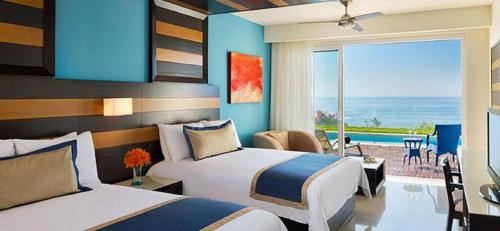 Imagen de la habitación del Hotel Secrets Huatulco Resort and Spa - Adults Only - All Inclusive. Foto 17