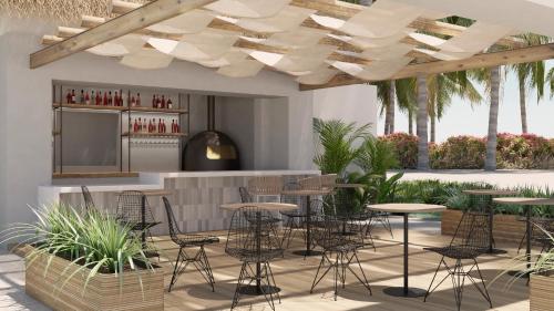 Imagen del bar/restaurante del Hotel Secrets Playa Esmeralda Resort & Spa. Foto 11