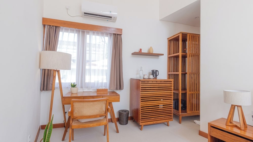 Imagen de la habitación del Hotel Segara Seaside Resort. Foto 5
