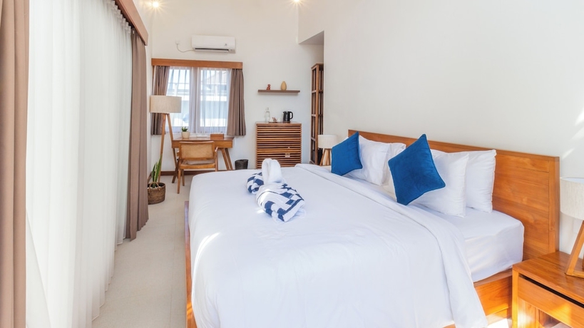 Imagen de la habitación del Hotel Segara Seaside Resort. Foto 6