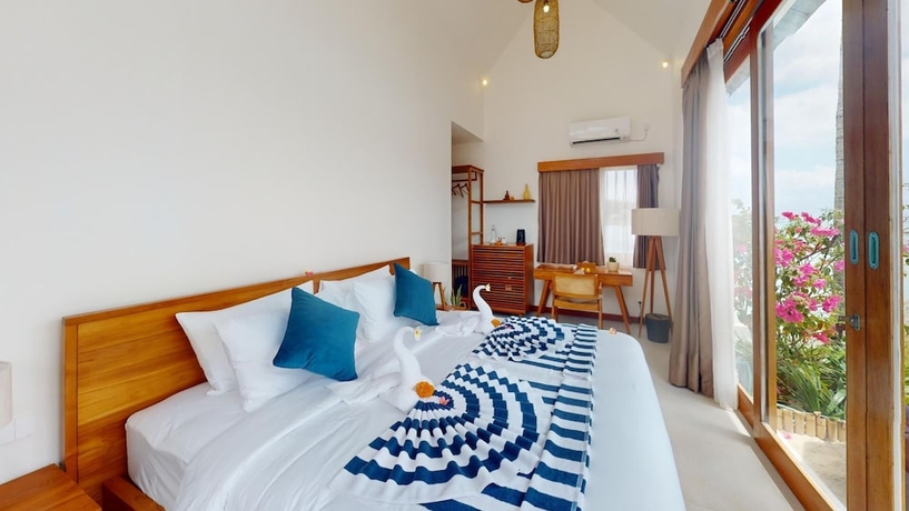 Imagen de la habitación del Hotel Segara Seaside Resort. Foto 13