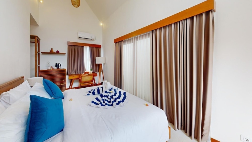 Imagen de la habitación del Hotel Segara Seaside Resort. Foto 15