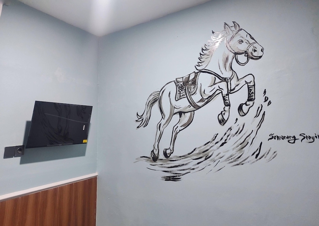 Imagen de la habitación del Hotel Semarang Co Stay. Foto 9