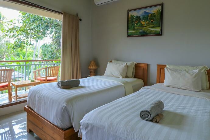 Imagen de la habitación del Hotel Senggigi Cottages Lombok. Foto 15