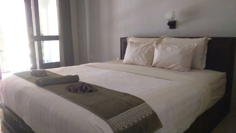 Imagen de la habitación del Hotel Senggigi Cottages Lombok. Foto 16