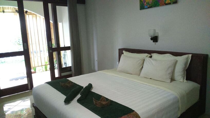 Imagen de la habitación del Hotel Senggigi Cottages Lombok. Foto 19